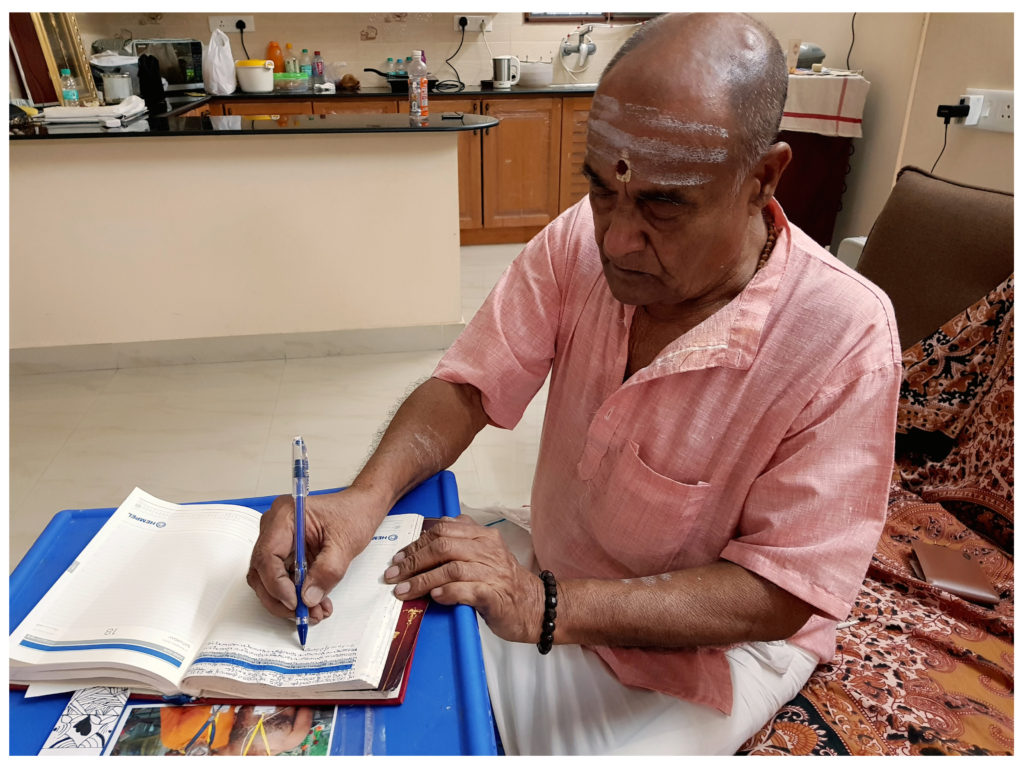 Yegnarama Narayanan writing in his current notebook