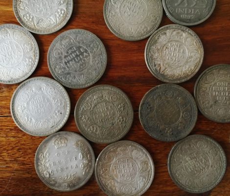 A collection of one rupee coins from 1904-1947, belonging to Bhag Malhotra