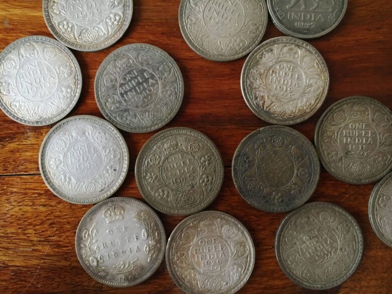 A collection of one rupee coins from 1904-1947, belonging to Bhag Malhotra