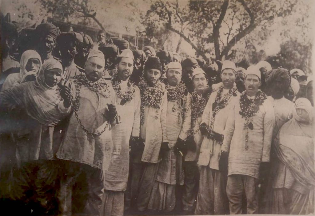 A photograph before Haveli Ram Musafar (second from right with the garland) was taken to prison