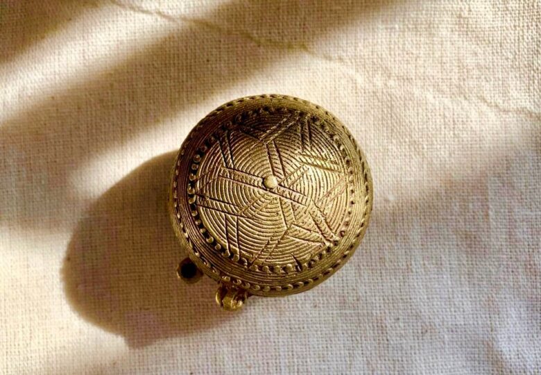 The brass coin box or karata